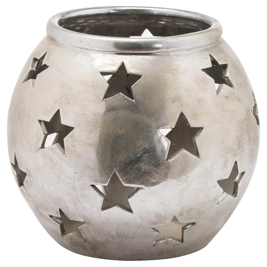 Silver ceramic tea light lantern with star cutouts casting patterned shadows, modern geometric decor  by Sostter at brixbailey.com