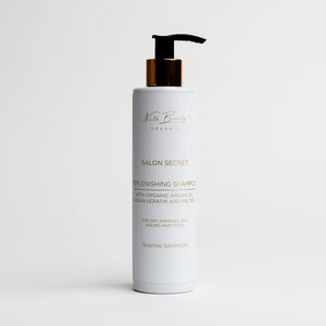 a soft-focused close-up of our vegan keratin conditioner-mask, its creamy texture glowing in warm morning light