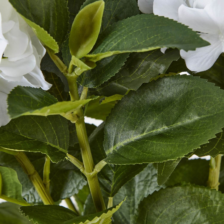 Lifelike white hydrangea arrangement with green foliage, realistic plastic petals, perfect for farmhouse or modern decor by Sostter at brixbailey.com