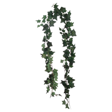 Lush artificial ivy garland with lifelike silk leaves in natural green hues, perfect for mantels and wedding decor by Sostter at brixbailey.com