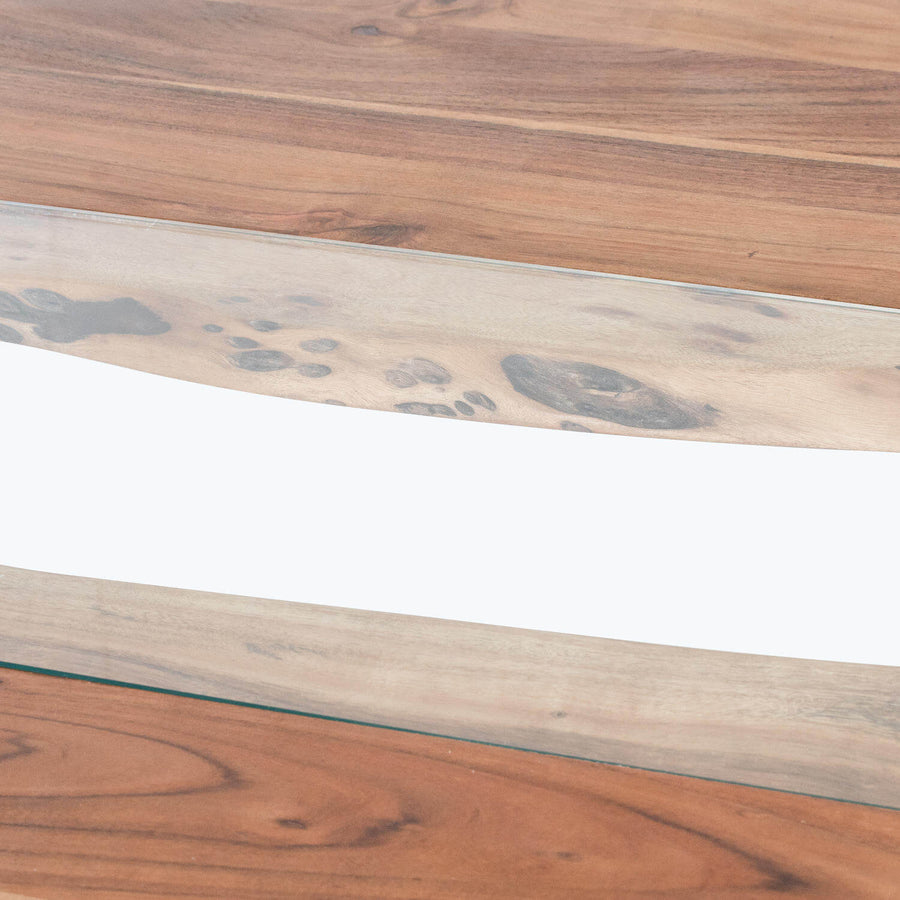 Live edge river dining table with glass center, warm brown wood, and metal frameâ€”unique grain patterns, modern rustic design. by Sostter at brixbailey.com