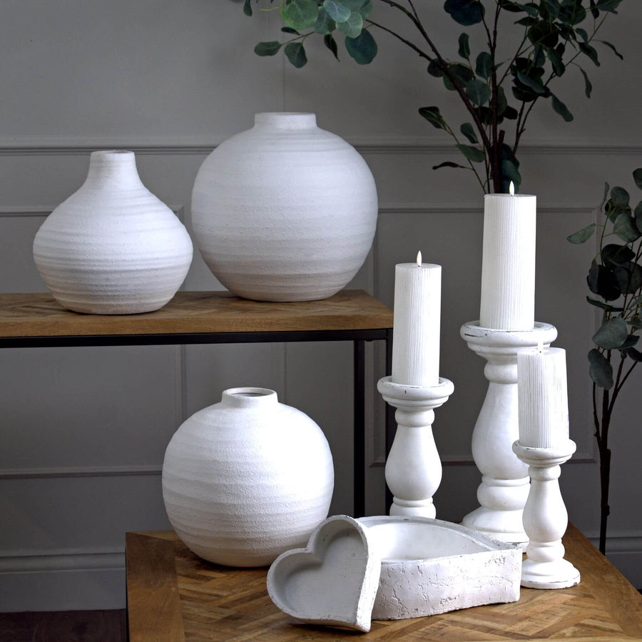 Handcrafted matte white ceramic vase with linear textures, modern minimalist design, perfect for floral displays. by Sostter at brixbailey.com