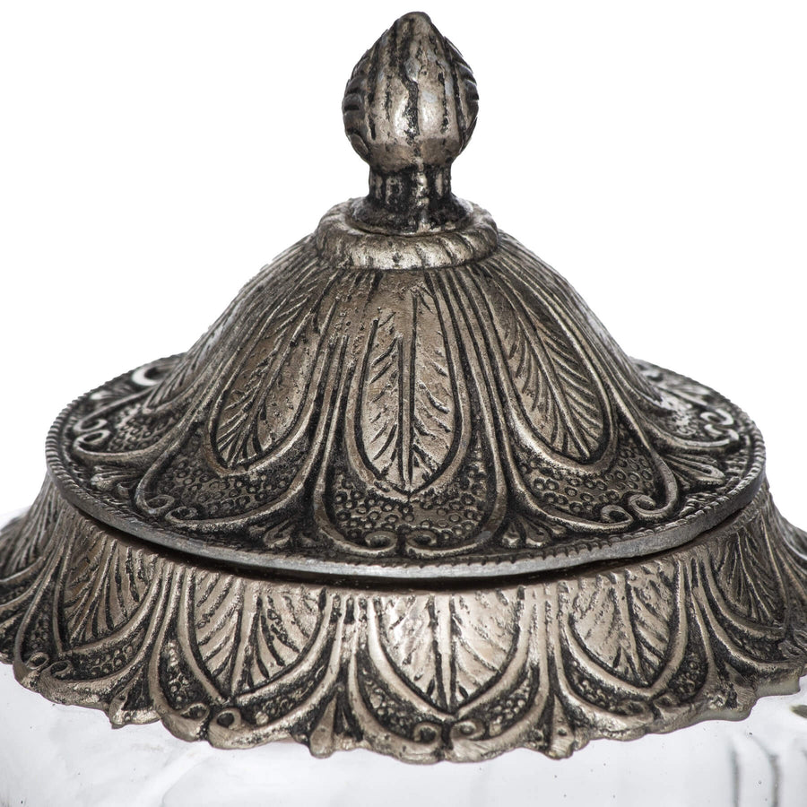 Handcrafted Moroccan lidded jar with hammered metal detailing and glass body for jewelry or spice storage. by Sostter at brixbailey.com