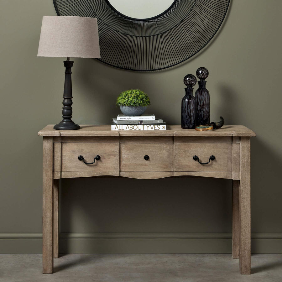 French provincial hardwood console with bleached finish, black iron handles, and spacious drawer for elegant storage. by Sostter at brixbailey.com