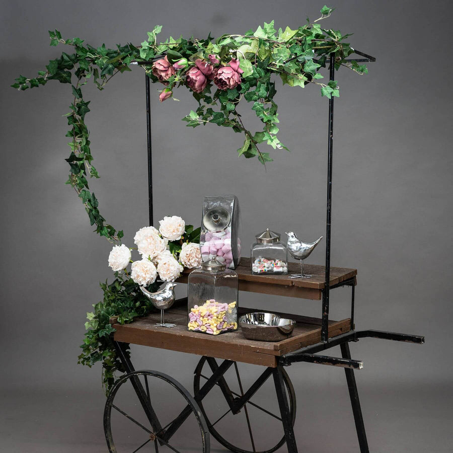 Lush artificial ivy garland with realistic silk leaves in natural green hues, perfect for mantels and wedding decor by Sostter at brixbailey.com