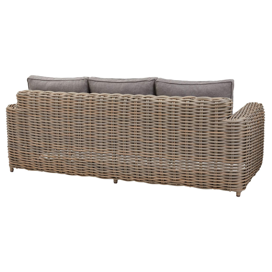 Premium beige outdoor wicker set with coffee table and Olefin cushions on patio by Hill Interiors at brixbailey.com