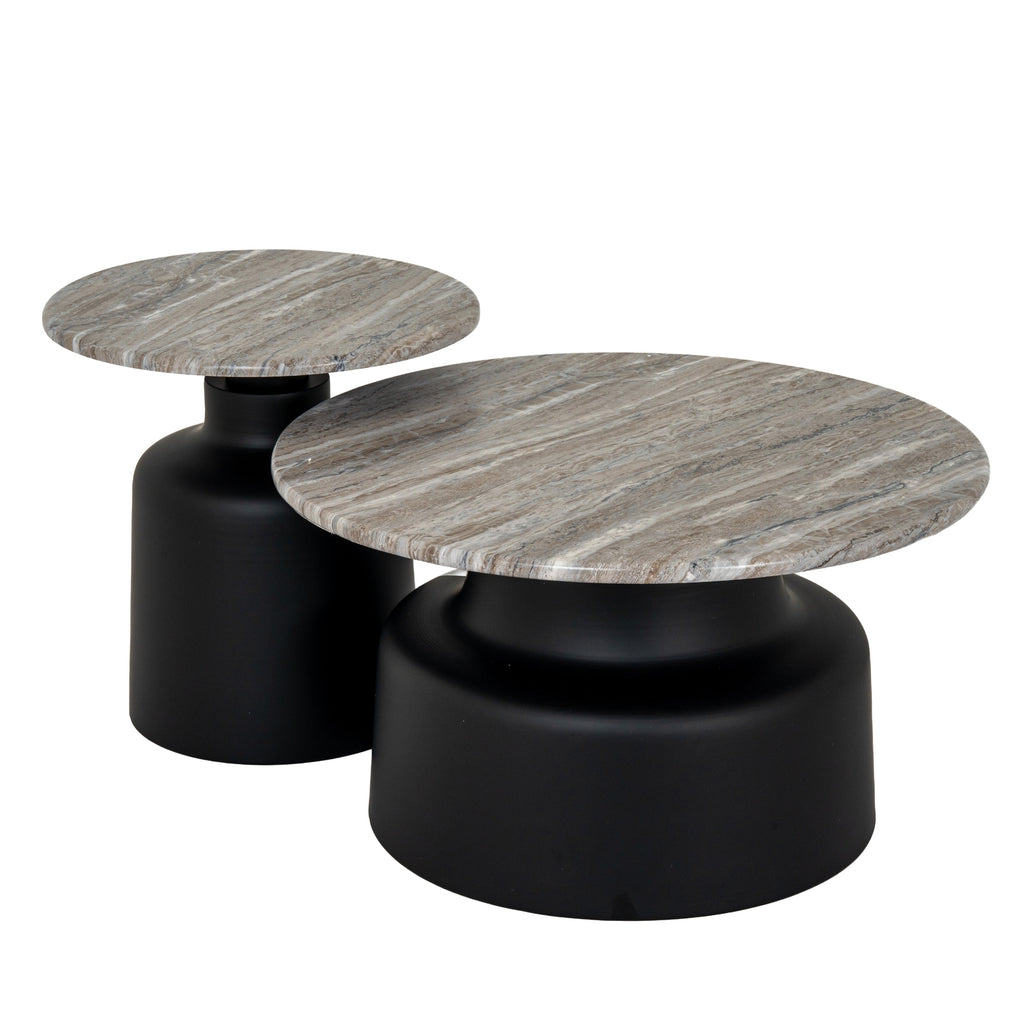 an elegant black metal side table with a circular top and tapered legs, showcased in soft, refined lighting
