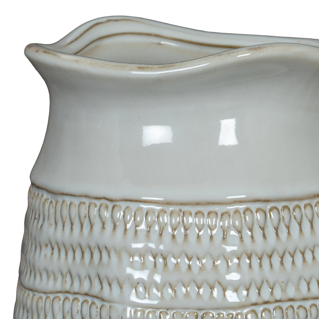 playful white ceramic vase with a fun, chunky texture on a bright yellow background
