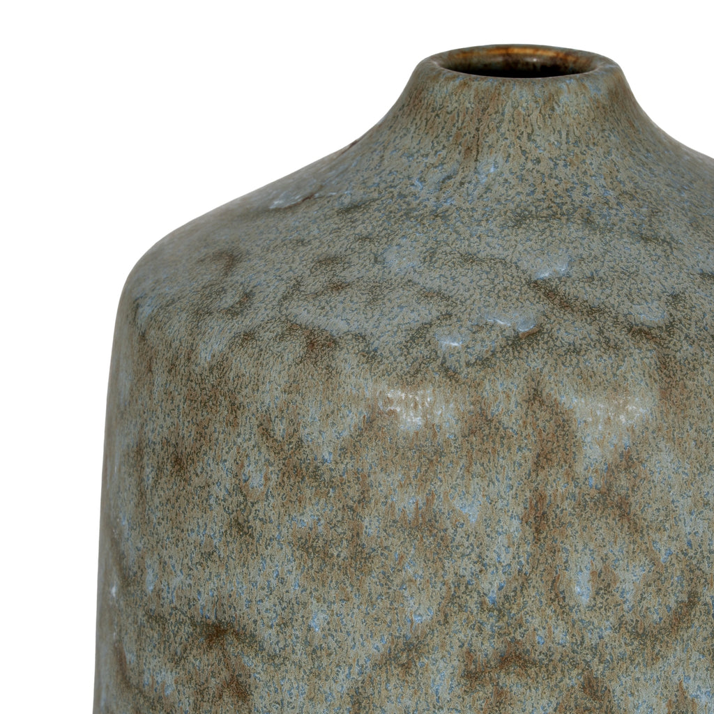 a soft grey ceramic vase with a comforting matte texture, bathed in gentle morning light