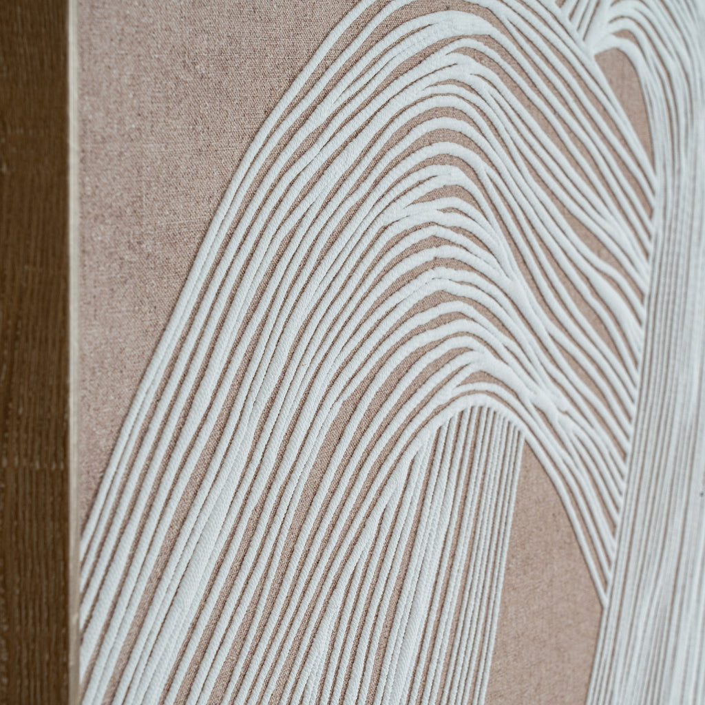 elegant framed minimalist line art print in a warm brown wood frame, showcased in a refined interior setting