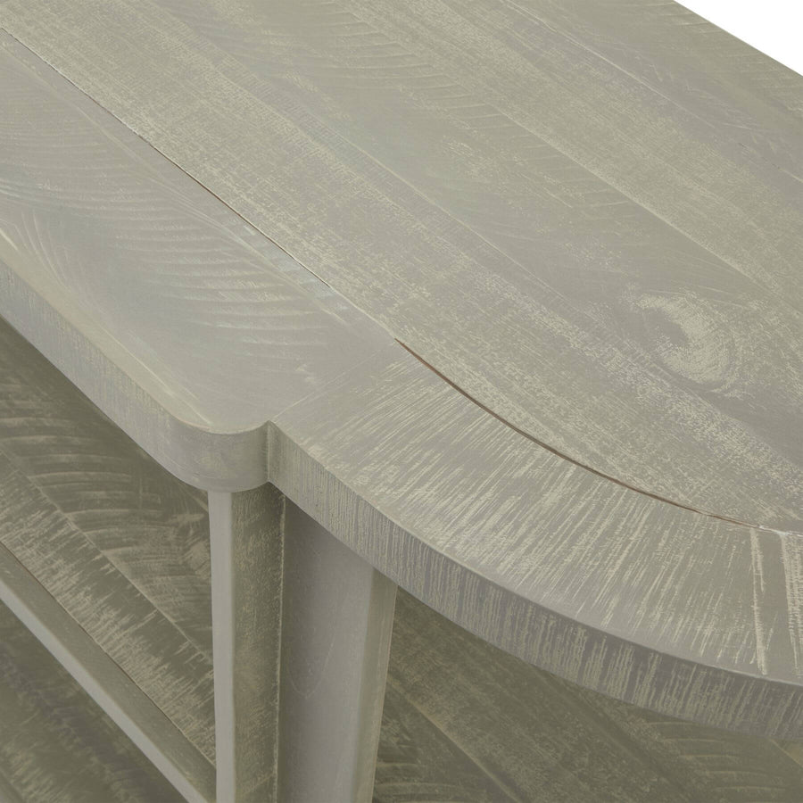 Hand-finished grey-washed pine console table with organic curves, natural wood grain, and contemporary artisan design. by Sostter at brixbailey.com