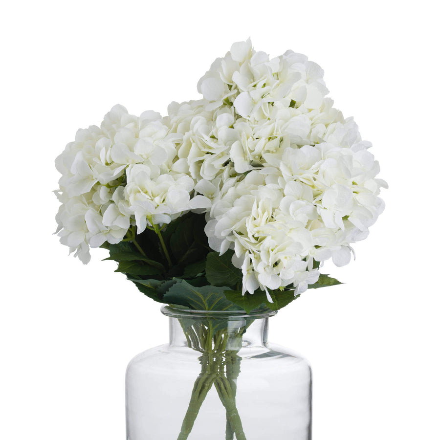 Lifelike creamy white hydrangea bouquet with realistic petals, perfect for timeless home decor and floral arrangements. by Sostter at brixbailey.com