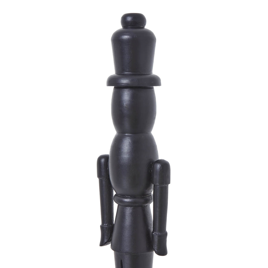 Black wooden Nordic nutcracker with minimalist design, 50cm tall, for modern Christmas decor by Sostter at brixbailey.com