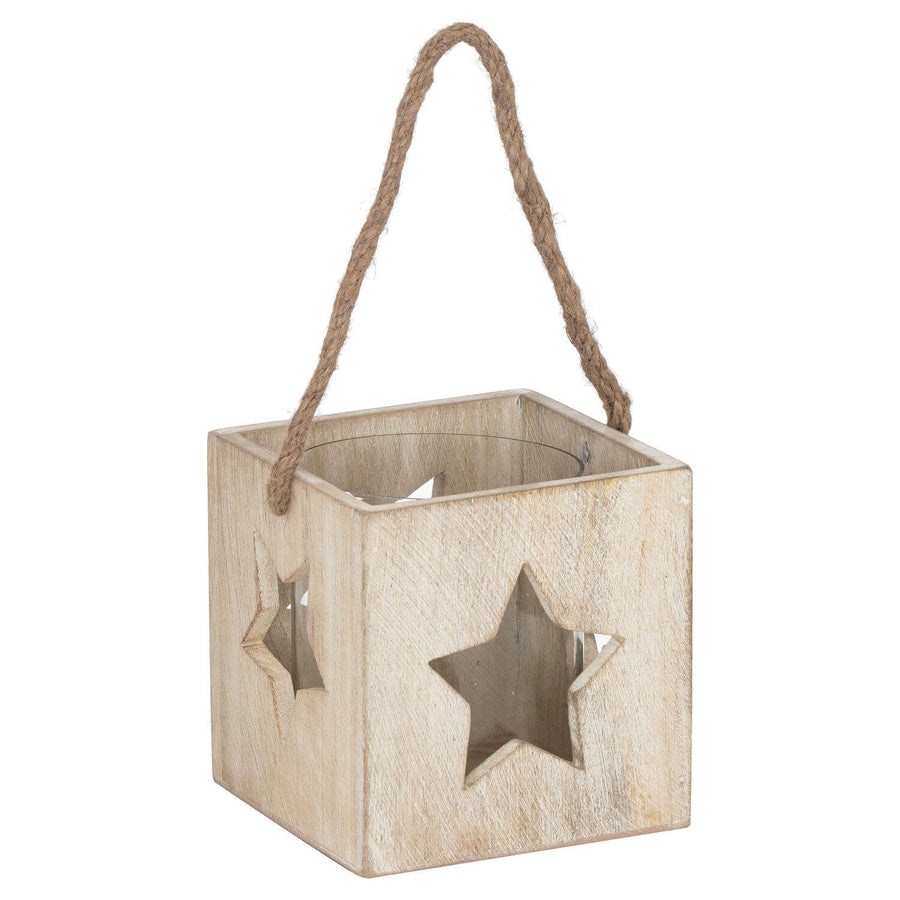 Handcrafted whitewashed wooden star tealight holder creating magical shadow patterns, 13cm tall, farmhouse decor. by Sostter at brixbailey.com