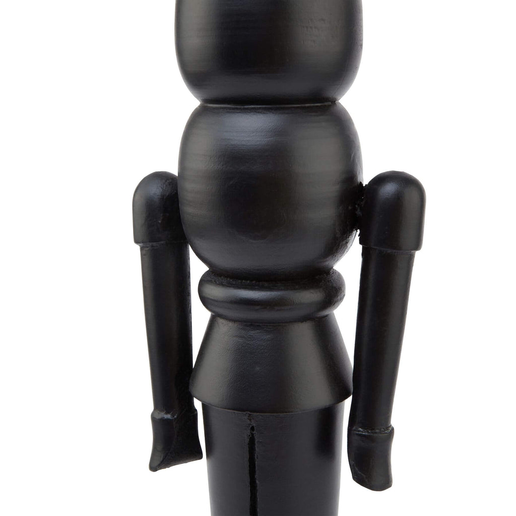 Black Scandinavian nutcracker with minimalist design, 60cm tall, hand-finished wood and metal holiday decor by Sostter at brixbailey.com
