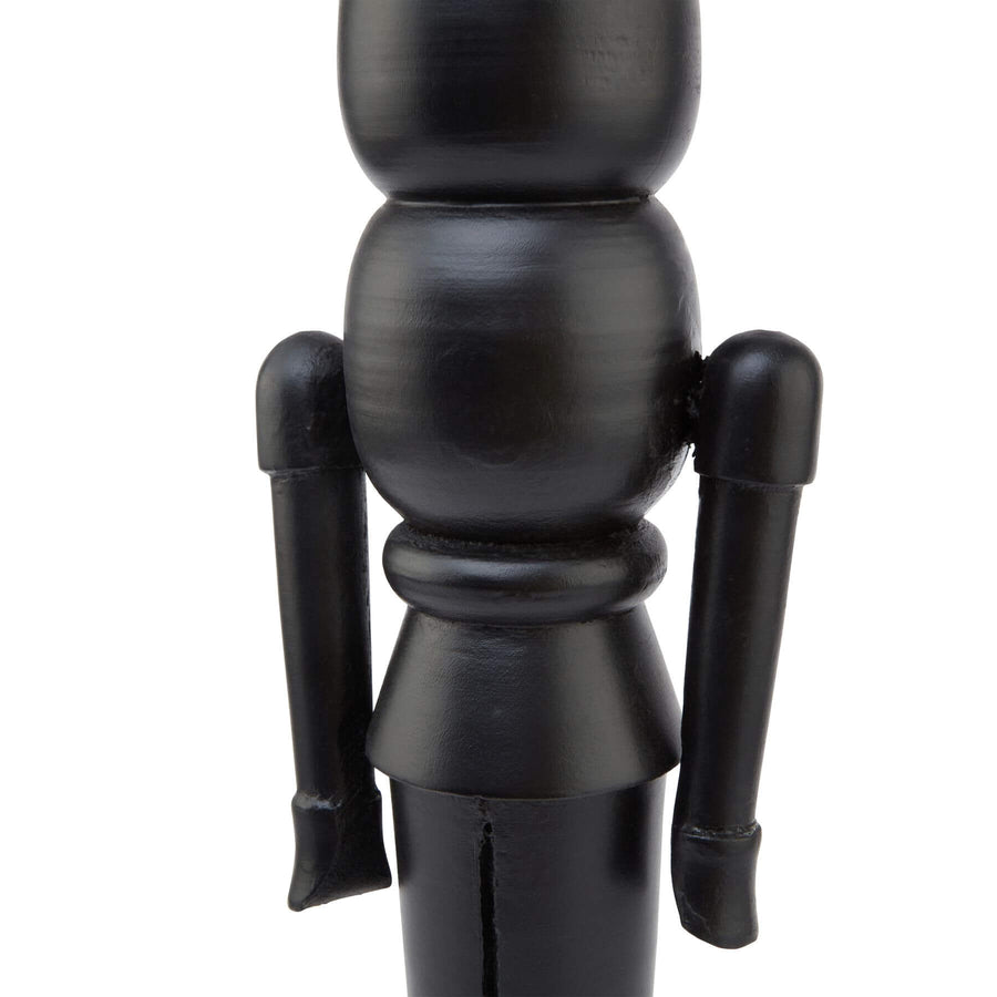Black Scandinavian nutcracker with minimalist design, 60cm tall, hand-finished wood and metal holiday decor by Sostter at brixbailey.com