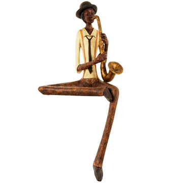 Handcrafted brown resin jazz saxophonist figurine with hanging leg, 38cm tall, for shelf or desk display. by Sostter at brixbailey.com