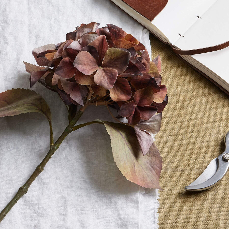 Lifelike autumn hydrangea stem with rich amber-brown petals, 50cm tall, perfect for fall decor by Sostter at brixbailey.com