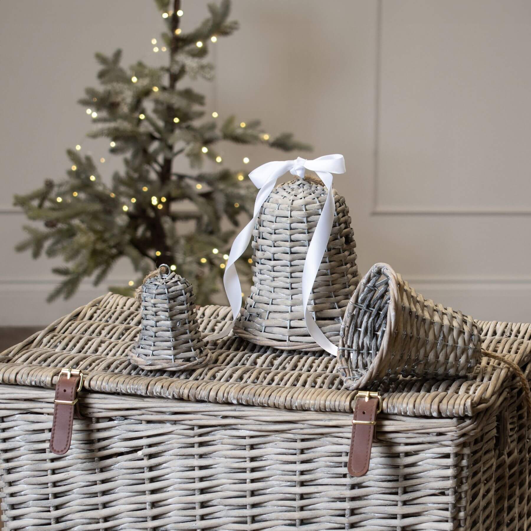 Handwoven rustic wicker Christmas bell in warm brown, artisan-crafted holiday decor with natural texture. by RoomLondon at brixbailey.com