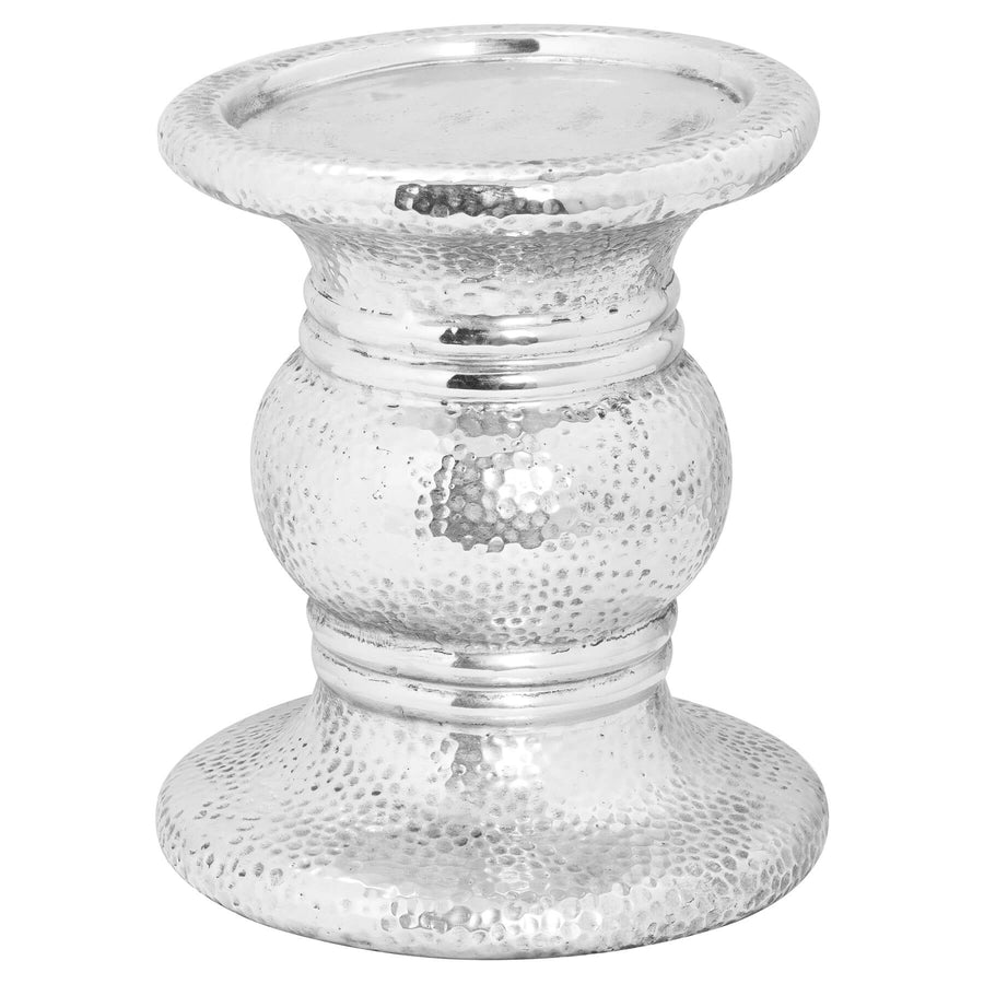Handcrafted ceramic candle holder with hammered silver finish, 24cm tall, creating warm ambient light for home decor. by Sostter at brixbailey.com