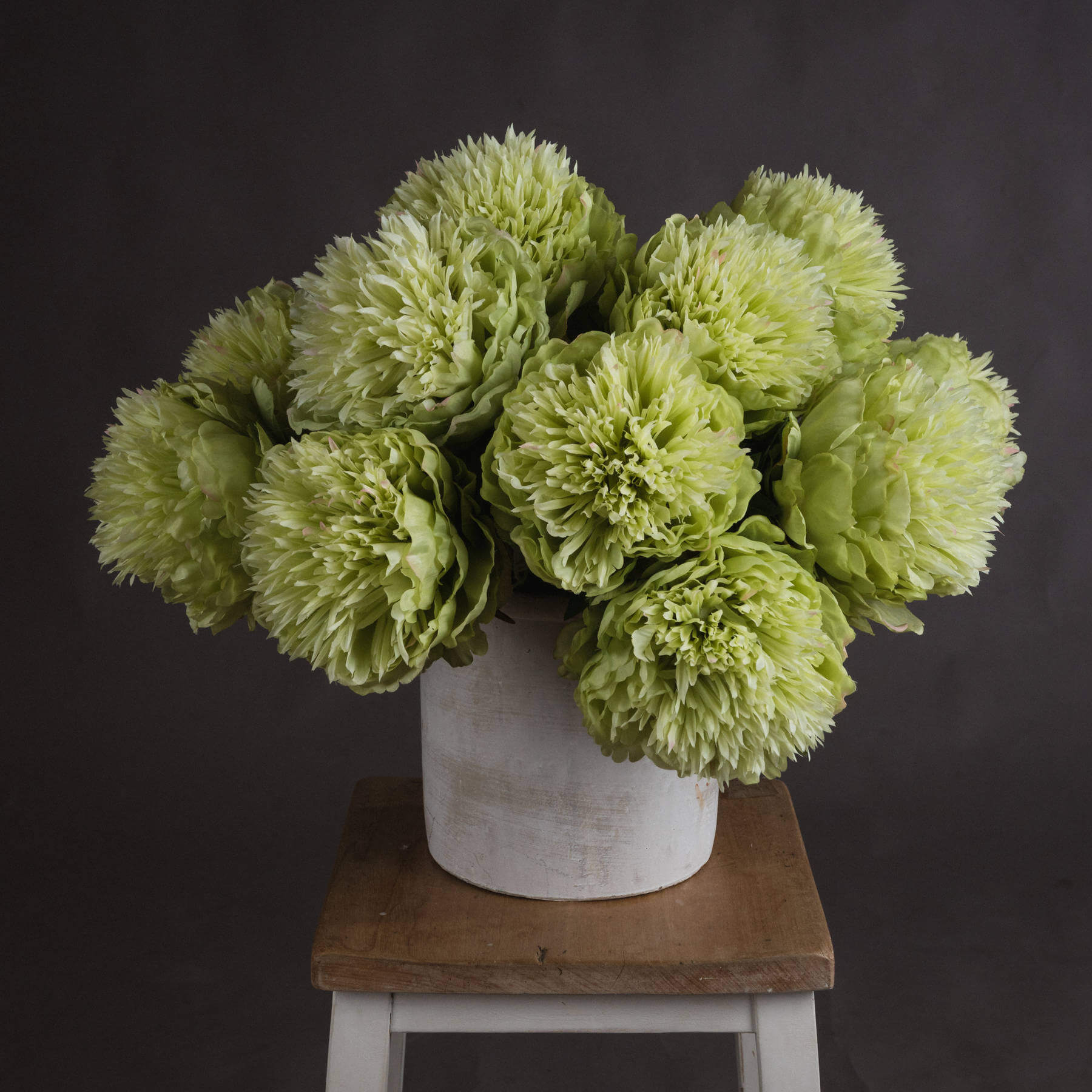 Lifelike green peony artificial stem with soft sage petals, perfect for farmhouse or contemporary decor by RoomLondon at brixbailey.com