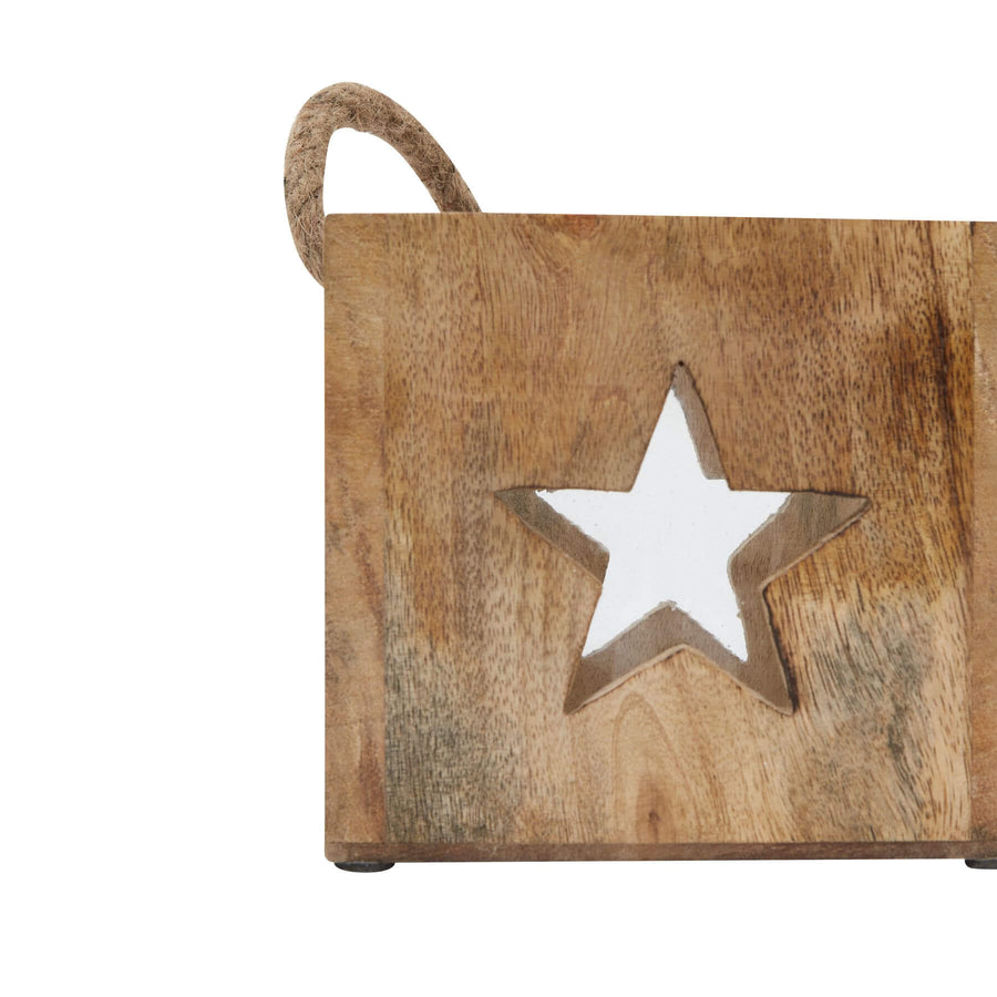 Handcrafted natural wooden star tealight holder with glass insert, casting warm glow in rich brown tones for cozy ambiance. by Sostter at brixbailey.com