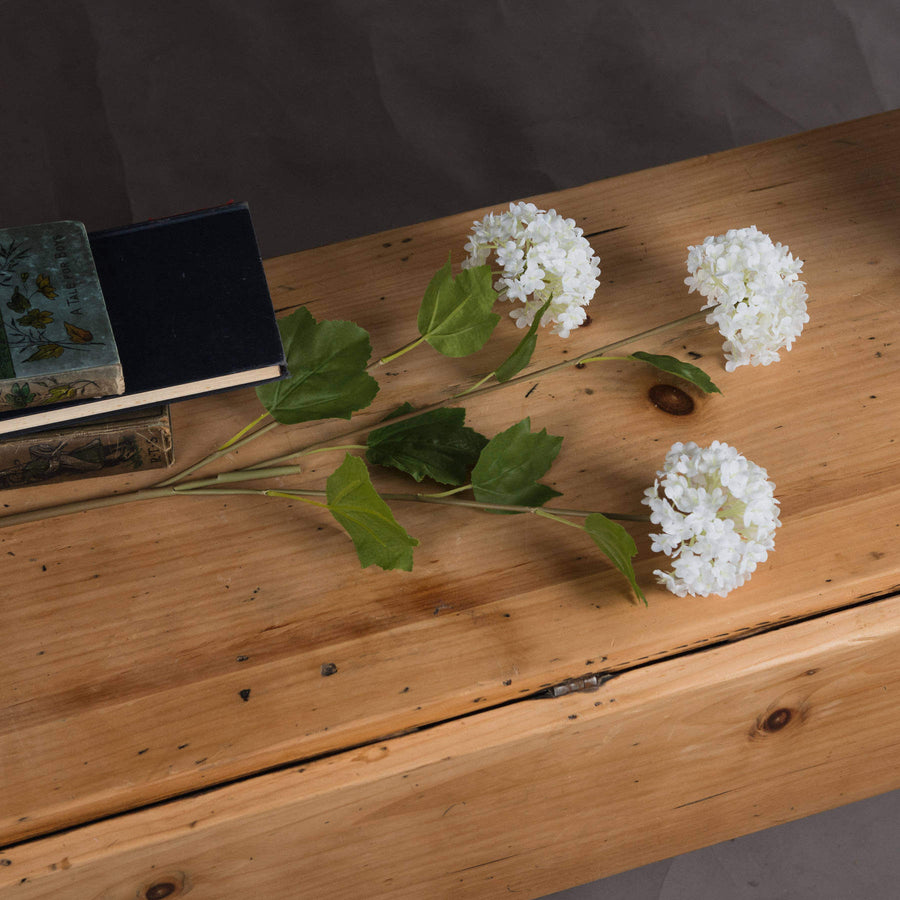 Lifelike white faux snowball blossom stem, 75cm, with realistic petals and flexible branches for elegant home decor by Sostter at brixbailey.com