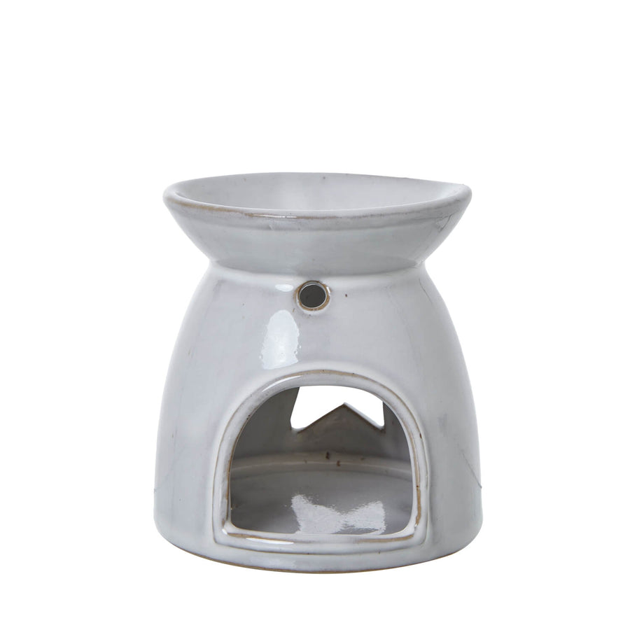White ceramic tealight holder with star cut-outs, casting enchanting light patterns, for wax melts or candles. by Sostter at brixbailey.com