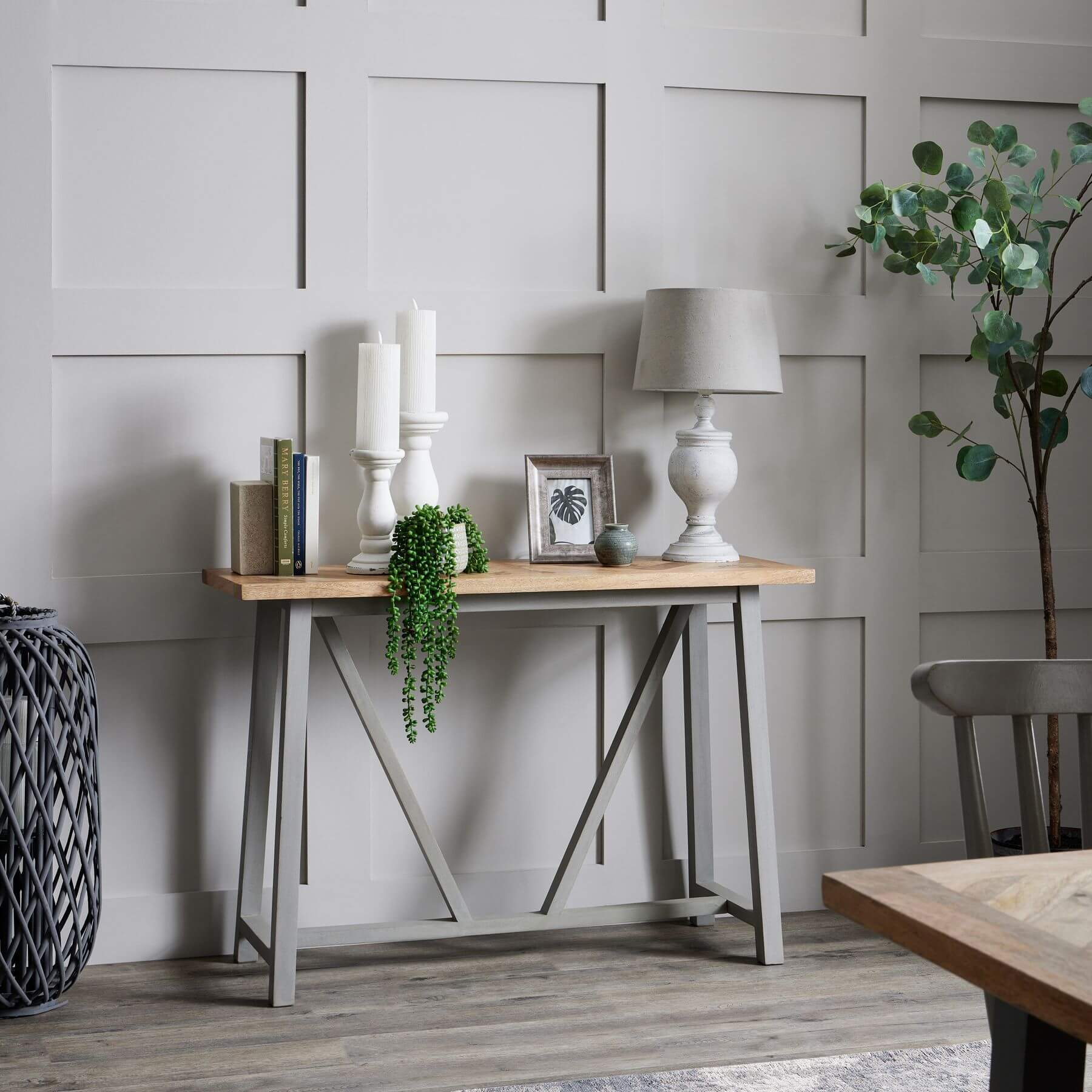 Uthina table lamp with wood base and linen shade in warm beige, creating soft ambient lighting for modern decor by Sostter at brixbailey.com