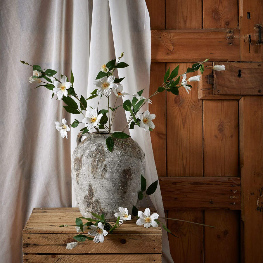 White artificial clematis stems with green foliage, hyper-realistic plastic flowers for everlasting home decor by Sostter at brixbailey.com