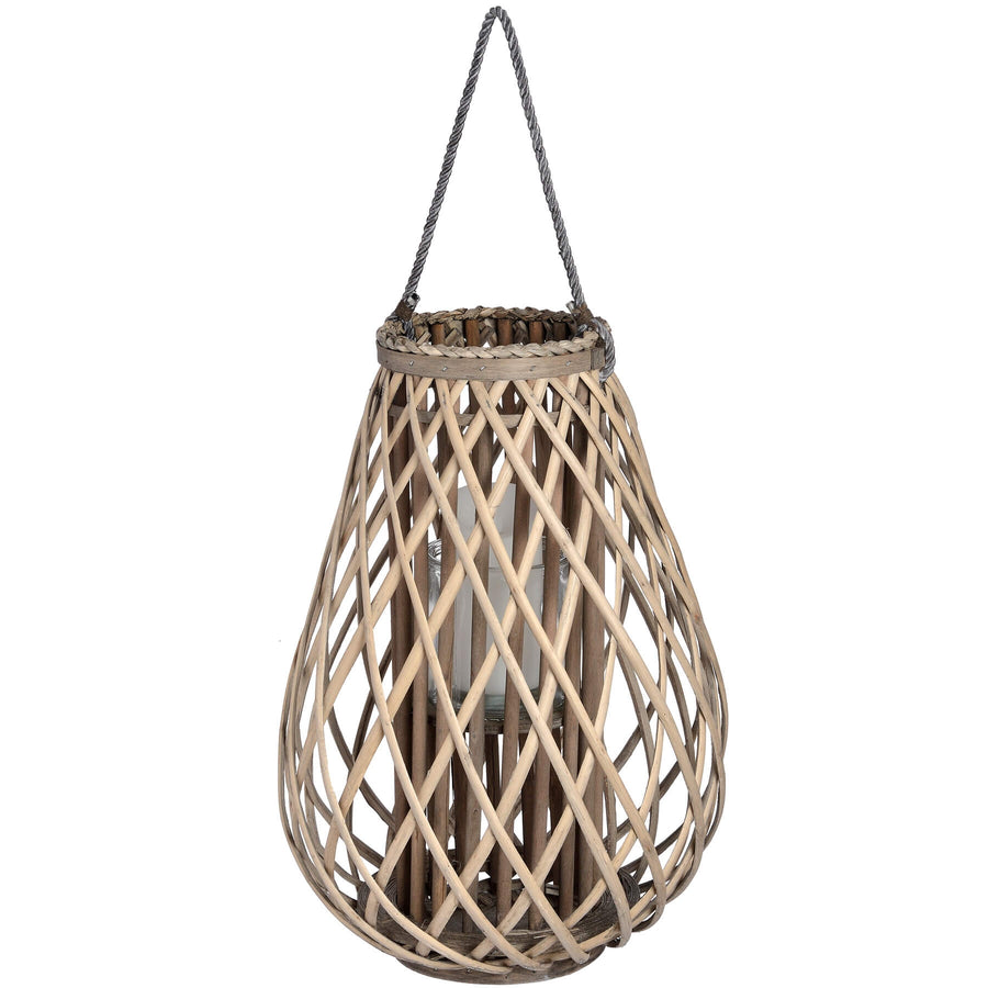 Handwoven rattan lantern with intricate wicker weave in warm brown, creating enchanting light patterns for indoor or outdoor decor. by Sostter at brixbailey.com