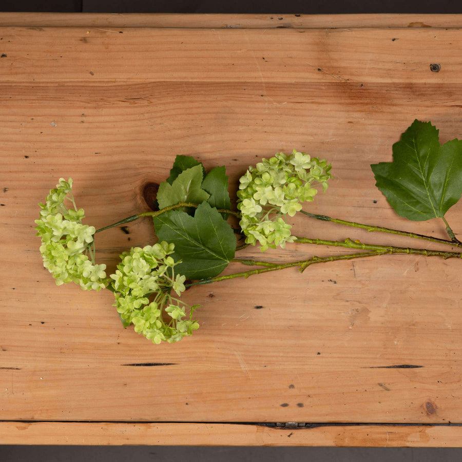 Lifelike artificial Viburnum spray with green foliage, perfect for vases, wreaths, and centerpieces. by Sostter at brixbailey.com