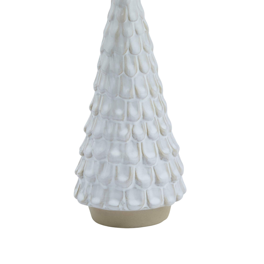 White ceramic winter decoration with intricate spruce silhouette, perfect for holiday decor by Sostter at brixbailey.com