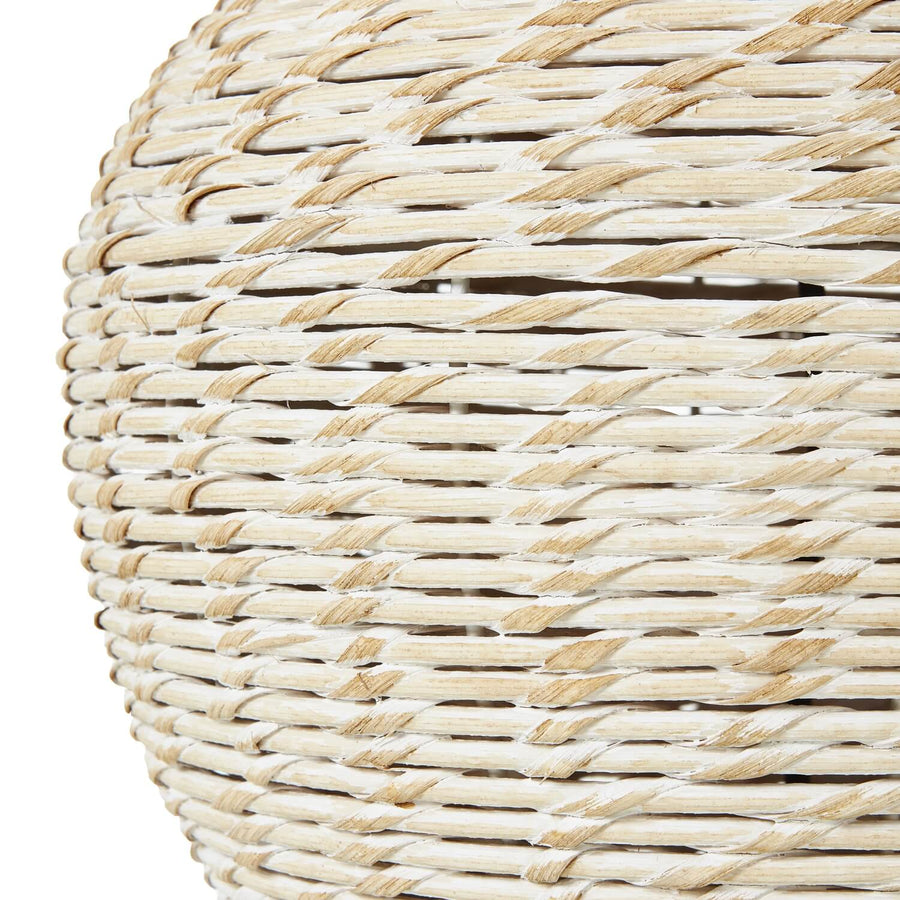 Handwoven wicker table lamp with whitewashed finish and neutral linen shade, artisan-crafted for cozy ambient lighting. by Sostter at brixbailey.com