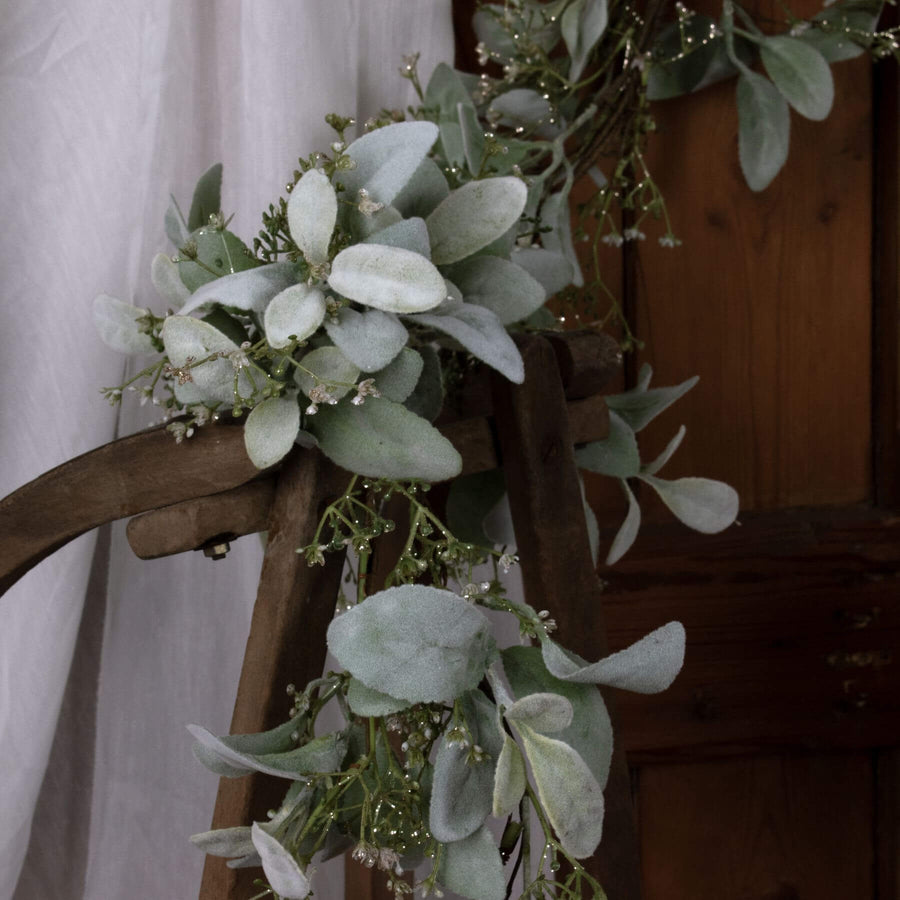 Elegant winter garland with soft grey lamb's ear foliage and delicate wax flowers, 153cm long, for mantels or tables by Sostter at brixbailey.com