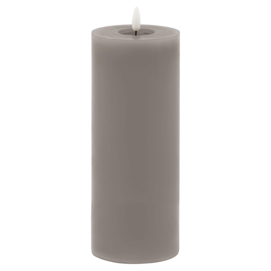 Grey LED wax candle with realistic flickering flame and dripped-wax texture, 23cm tall, battery-operated for safe ambiance (124 chars) by Sostter at brixbailey.com