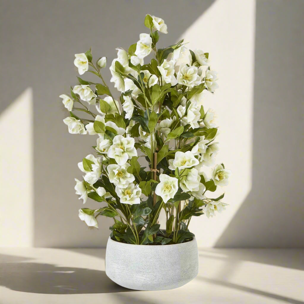 White faux hellebore floral arrangement in grey planter, lifelike blooms with green stems, home decor centerpiece by Sostter at brixbailey.com