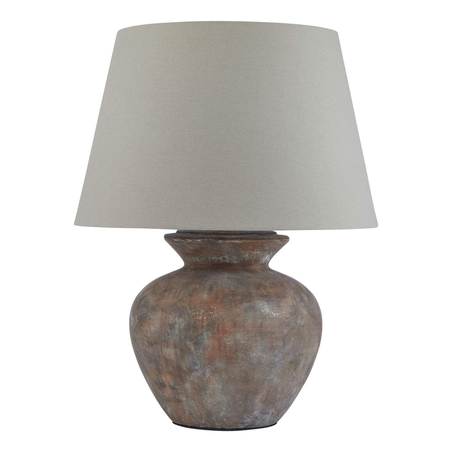 Rustic ceramic table lamp with weathered gray-brown finish and neutral beige fabric shade, 63cm tall.by Sostter at brixbailey.com