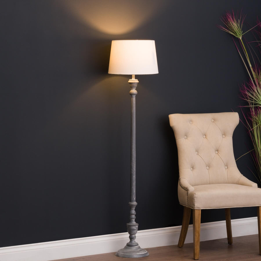 Ithaca floor lamp with carved wood base and linen shade in warm beige, perfect for living room lighting. by Sostter at brixbailey.com