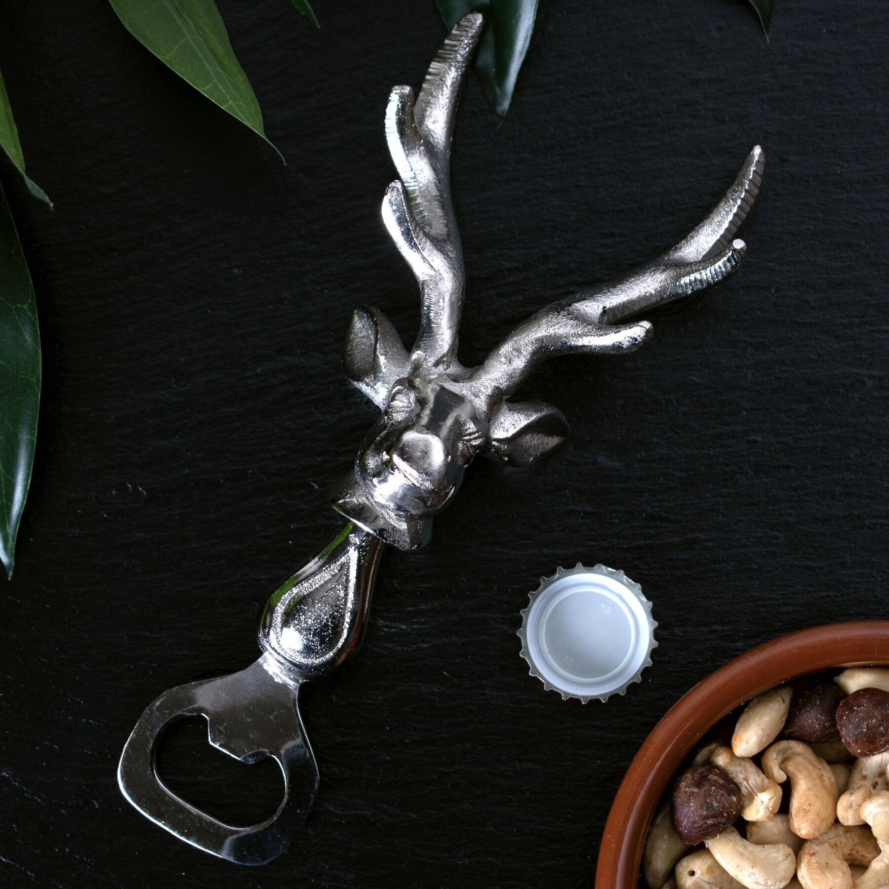 Silver nickel stag head bottle opener with polished metal finish and ergonomic grip by Sostter at brixbailey.com