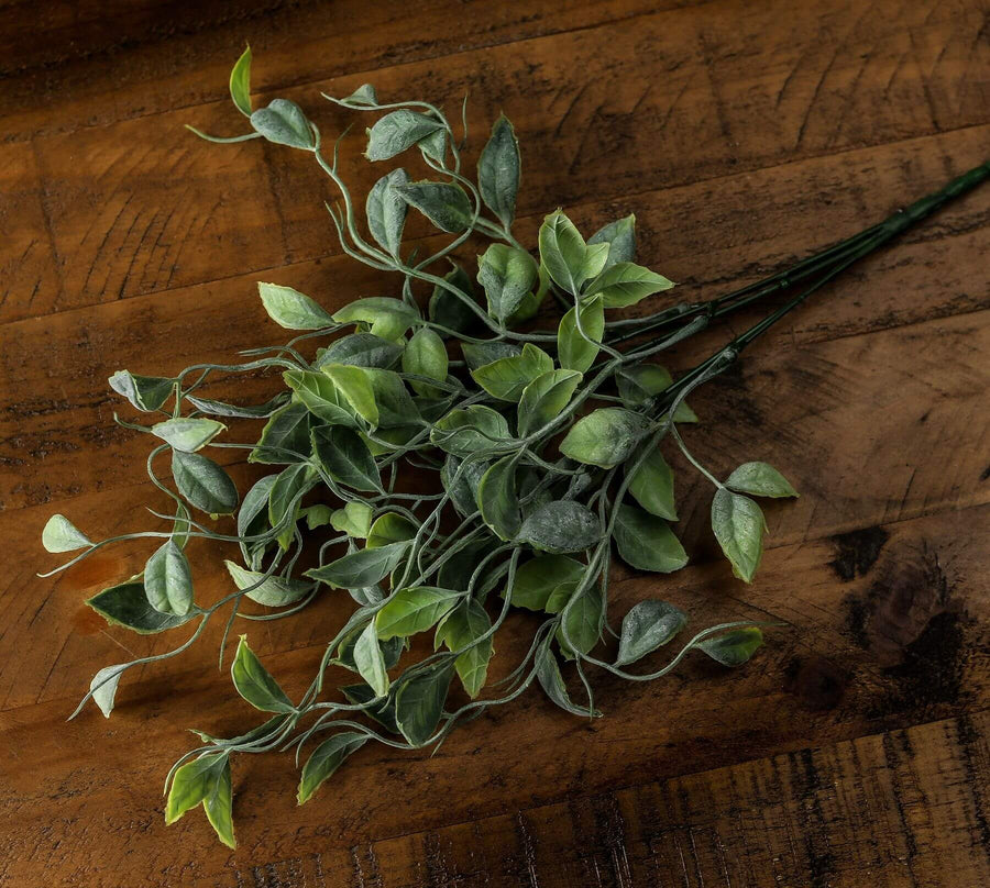Lifelike green shoots artificial greenery bunch with natural movement and realistic textures, perfect for home or office decor. by Sostter at brixbailey.com