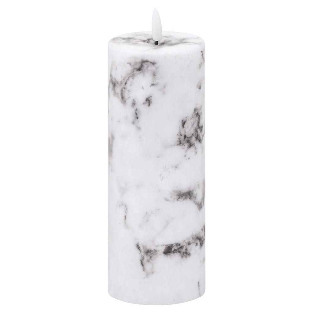 White marble-effect LED pillar candle with amber glow and natural veining, flameless battery-powered home decor. by Sostter at brixbailey.com