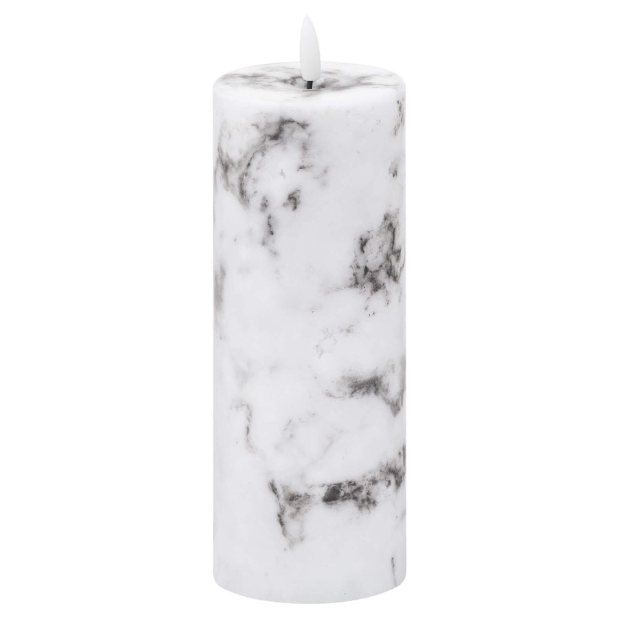 White marble-effect LED pillar candle with amber glow and natural veining, flameless battery-powered home decor. by Sostter at brixbailey.com