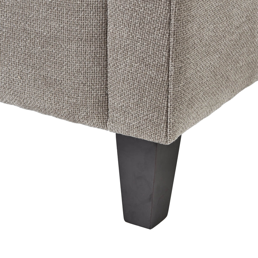 Taupe snuggle chair with plush cushioning and solid wood frame, perfect for modern farmhouse or contemporary decor. by Sostter at brixbailey.com