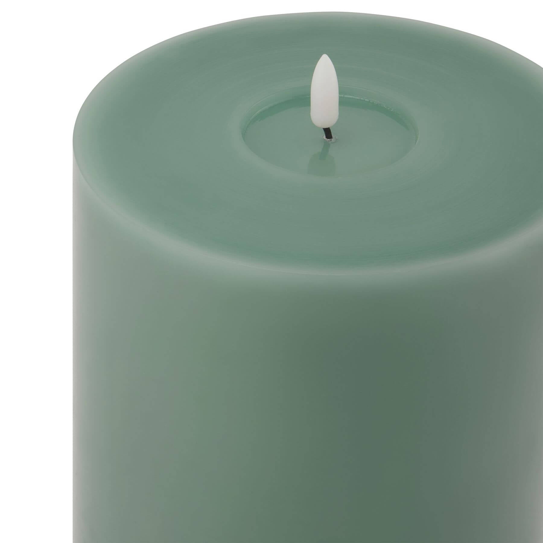 Sage green LED wax candle with realistic melt effect, battery-operated for flameless ambiance by Sostter at brixbailey.com