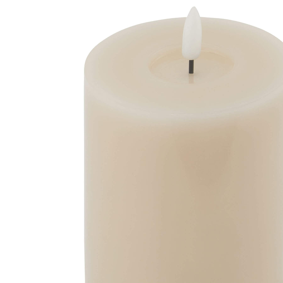 Taupe LED wax candle with realistic dripping effect, flickering flame, and neutral decor-friendly design from Luxe Collection. by Sostter at brixbailey.com