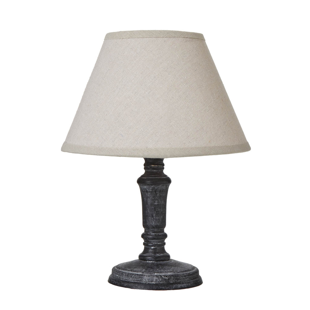 Distressed black Palmyra Column Table Lamp with neutral linen shade, rustic wood base, 20cm height, grey farmhouse decor.by Sostter at brixbailey.com