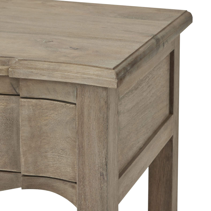 Handcrafted French provincial side table with hardwood construction, bleached finish, and black iron handles for rustic elegance. by Sostter at brixbailey.com