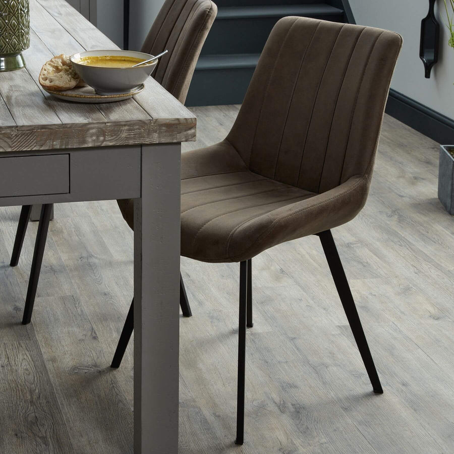 Malmo coffee brown dining chair with channel-stitched faux leather seat and black metal legs, modern contemporary design by Sostter at brixbailey.com