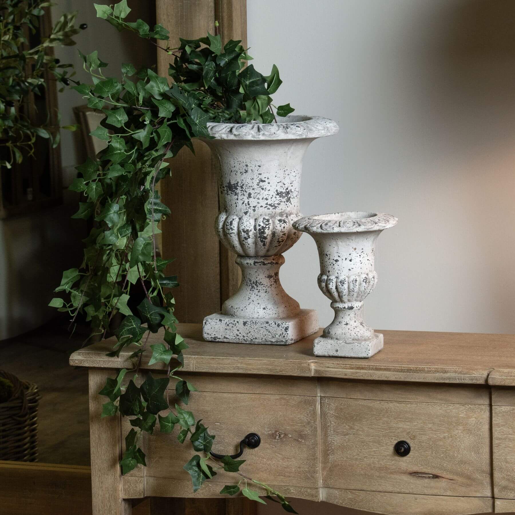 Handcrafted stone-effect ceramic urn with fluted design, neutral color, and classical-modern style for home decor. by Sostter at brixbailey.com